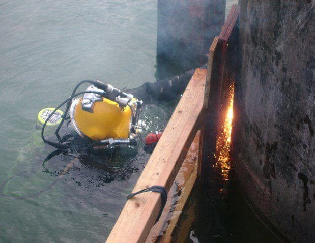 Fixing dam spillway problems with coordinated divers